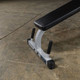 Body-Solid Seated Leg Trainer Showing Stabilizing Hand Grips
