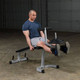 Body-Solid (PLCE165X) Leg Extension/Curl - Man Performing Quad Extension Exercise