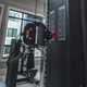 TKO Dual Pulley System Showing Adjustable Pulley and Exercise Placard