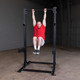 Body-Solid Pro Clubline Half Rack - Leg Raise Exercise from Pull-Up Bar