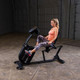 Body-Solid (B4RB) Recumbent Exercise Bike - Woman Exercising Side View
