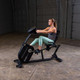 Body-Solid (B4RB) Recumbent Exercise Bike - Woman Training Side View