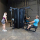 Body-Solid Shared Strength Gym with Four Users Exercising