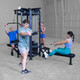 Body-Solid (SJG100) 4-Station Jungle Gym - Four Users Working Out