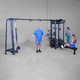 Body-Solid (SJG500) 5-Stack Jungle Gym - 4 People Exercising