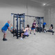 Body-Solid (SJG800) 8-Stack Jungle Gym - 6 Users Exercising in Fitness Room