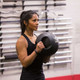 Body-Solid Dual-Grip Medicine Ball - Woman Exercising in Gym