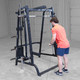 Man Working Out on Body-Solid Smith Rack Package