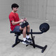 Body-Solid Seated Calf Machine - Man Exercising