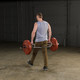 Body-Solid Hex Bar with Raised Handles - Man Exercising in Fitness Room
