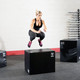 Woman Jump Training on Body-Solid Soft 3-Way Plyo Box in Fitness Studio