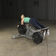 Body-Solid (LVLC) Leverage Leg Curl Machine - Woman Exercising w/ Optional Plates