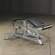 Body-Solid LVLC Plate-Loaded Hamstring Curl Machine Setup in Light Commercial Fitness Space