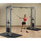 Body-Solid (SCC1200G) Dual Pulley Weight Machine - Woman Cable Cross Exercising