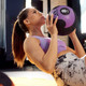Woman Training with Aeromat Medicine Ball in Gym