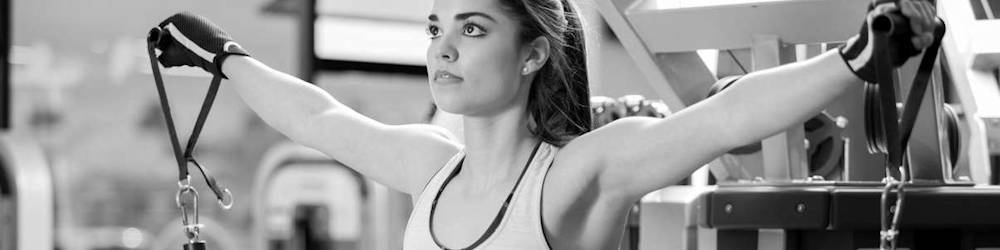 Woman Exercising on Commercial Cable Machine in Gym