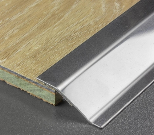 Stainless steel ramp transition profile to give a clean-cut and elegant transition between hardwearing surfaces and thin materials like carpet tiles and linoleum.