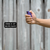 Hand holding and deploying Police Magnum 0.5oz stream pepper spray for quick self defense