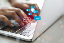 Image of person typing overlaid with social media icons