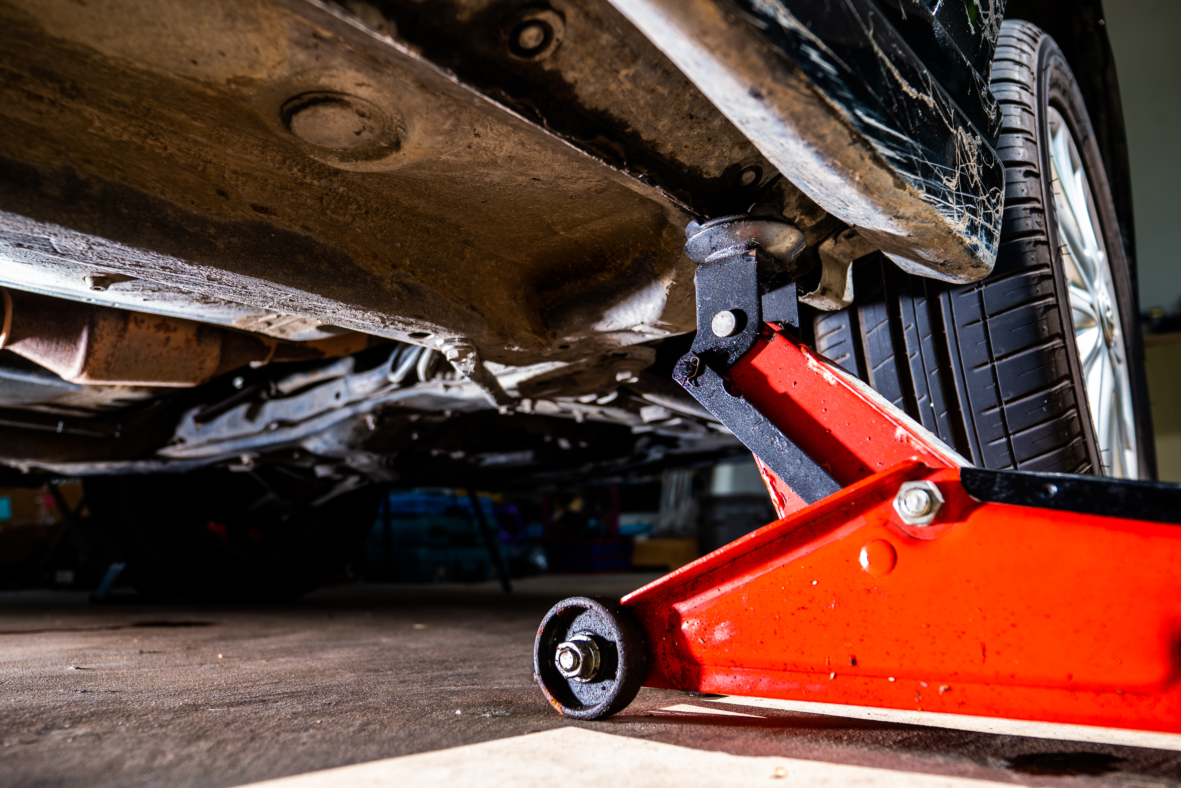 Vehicle on Jacks prepared to be undercoated