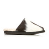 Classic backless sheepskin slipper, featuring a soft sheepskin inner and a striking black-and-white calfskin outer.