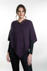 Women's stitched poncho in aubergine color, made of possum merino.