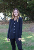 Classic dark gray cardigan with V-neck and light colored buttons, made of soft alpaca wool.