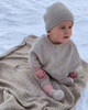 Cute baby wrapped in comfy merino silk baby blanket