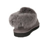 Close up of a gray sheepskin slipper showing its closed heel and fluffy collar.