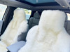 Close-up texture of fluffy white premium New Zealand sheepskin wool