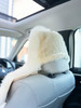 Rear view of car seat showing the secure stretch synthetic backing on headrest