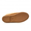 Close up of the side stiched soles of light brown indoor sheepskin slippers.