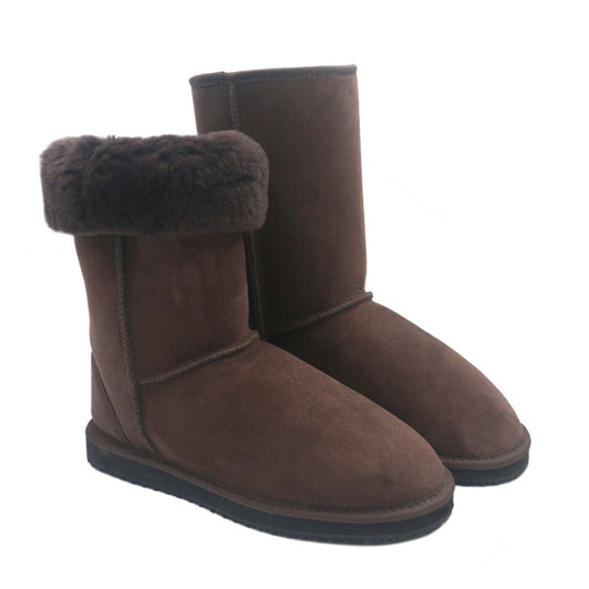 Tall chocolate brown boots made of twin faced sheepskin with 1 shoe folded at the collar to show the plush fleece inside. Tall chocolate brown boots made of twin faced sheepskin with 1 shoe folded at the collar to show the plush fleece inside.
