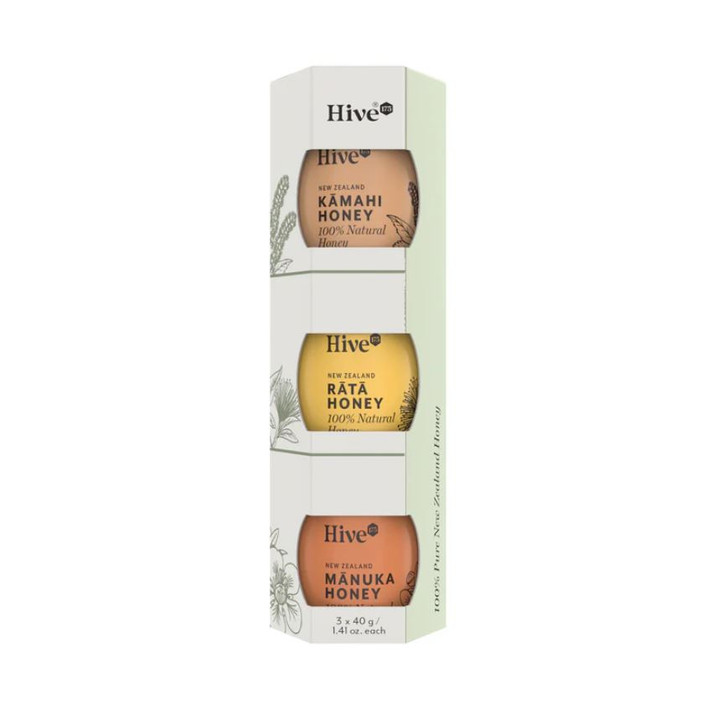 Three mini jars of honey in different variants, Kamahi, Rata and Manuka, in a tall gift box.