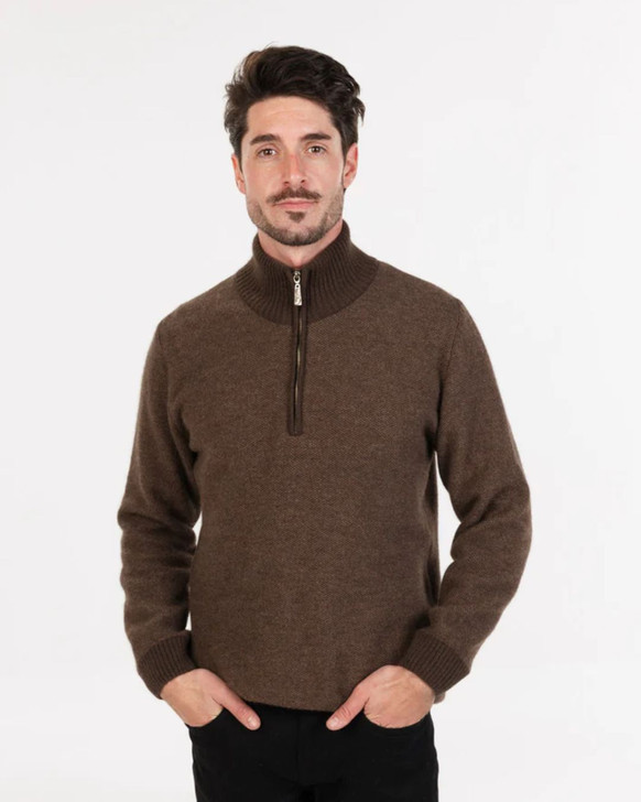 A man wearing a Possum Merino Textured Half Zip Sweater