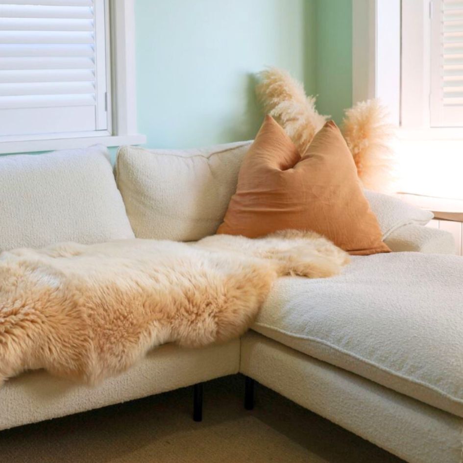 Sheepskin Rugs in Honey colour on a couch