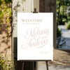 Classic and elegant wedding welcome sign clipped to an easel. 