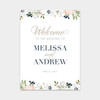 An elegant garden wedding welcome sign with floral illustrations and classic fonts.