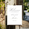 Simply elegant welcome wedding sign clipped to an easel. 