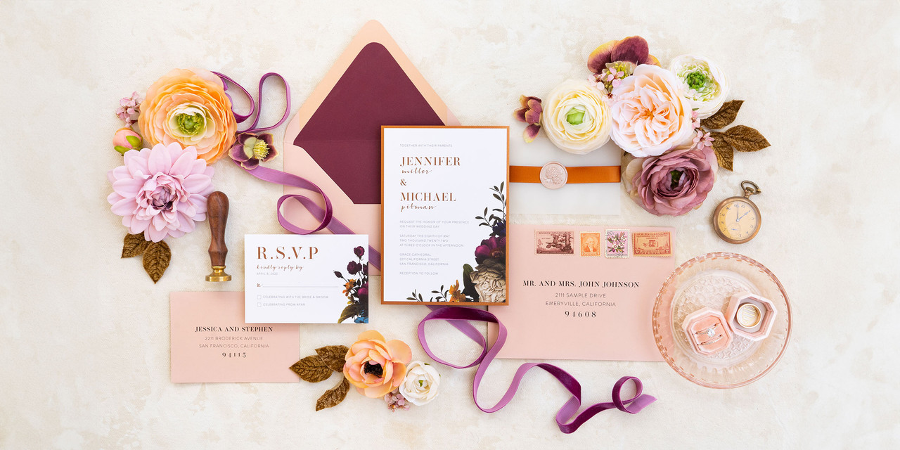 Wedding invitation suite in blush and wine colors