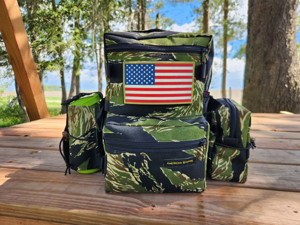 Tiger Stripe pack shown with water bottle pouch, side pouch, black logo. Flag patch not included.