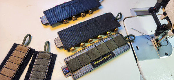 Velcro .410 shotgun shell carrier with elastic webbing.