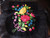 Black Veracruz apron made of velvet with black lace and large colorful flowers