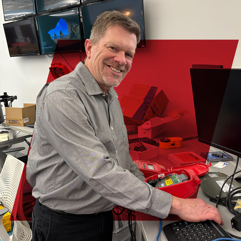 Dave Zelnio, Customer Success Manager, tinkers with a 3DLevelScanner to help a customer troubleshoot their level sensor