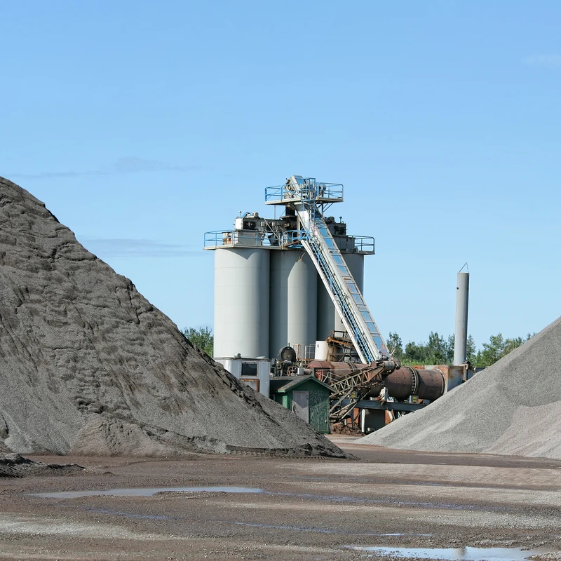 BinMaster's hanging tilt switch, the BM-T, is suspended over a material pile, conveyor, or chute, typically in aggregate and mining applications