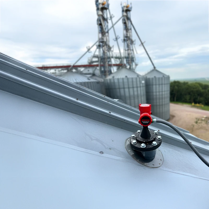 Non-contact radar sensor mounted atop a grain bin; sends automated measurements to software or controls so workers don't have to measure levels manually