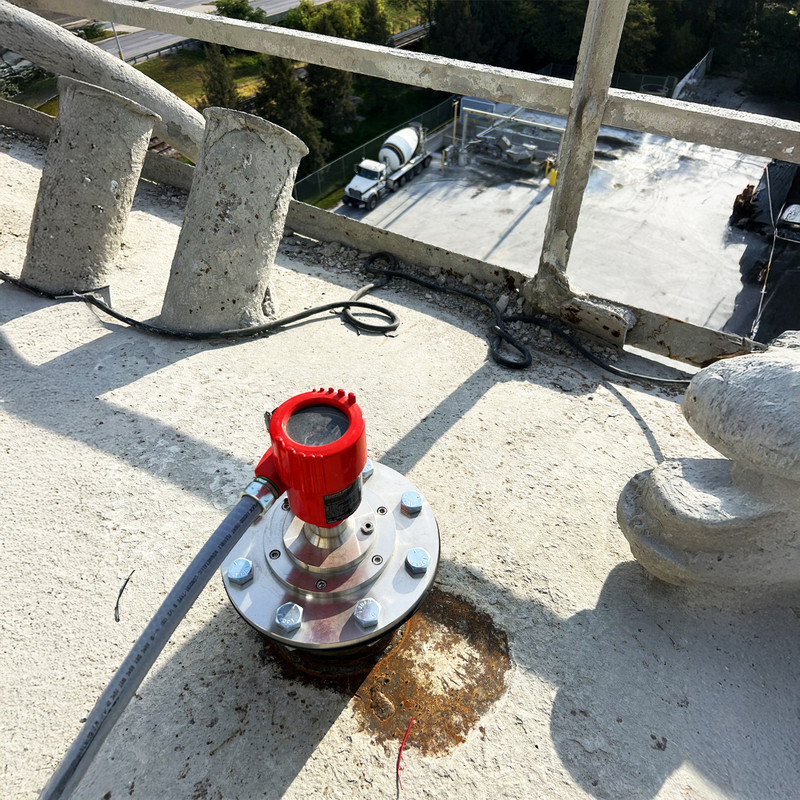 NCR-86 radar sensor mounted atop a cement silo