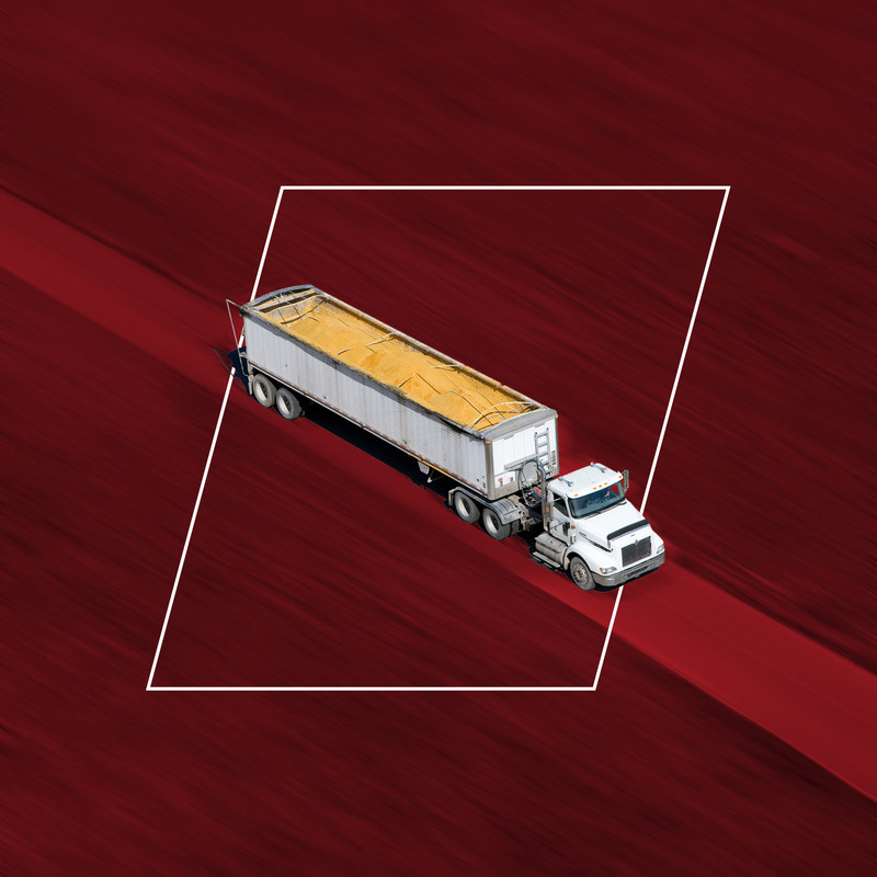 A truck hauls the exact amount of grain that will fit into a customer's grain bin thanks to inventory software and level sensors from BinMaster