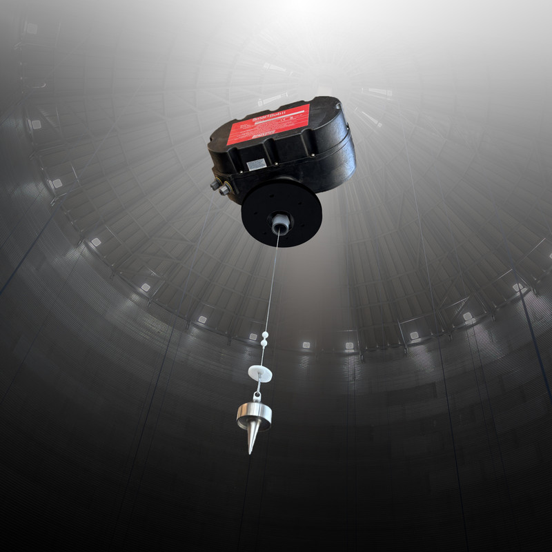 SmartBob drops a weighted cable to the bulk material surface. It counts the pulses it takes to retract and converts them to an inventory measurement