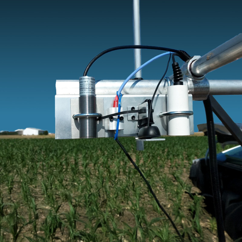 General-purpose ToughSonic ultrasonic sensor installed on an agricultural vehicle for plant level monitoring